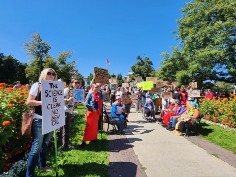 Attendees of the climate rally gather in downtown Peterborough